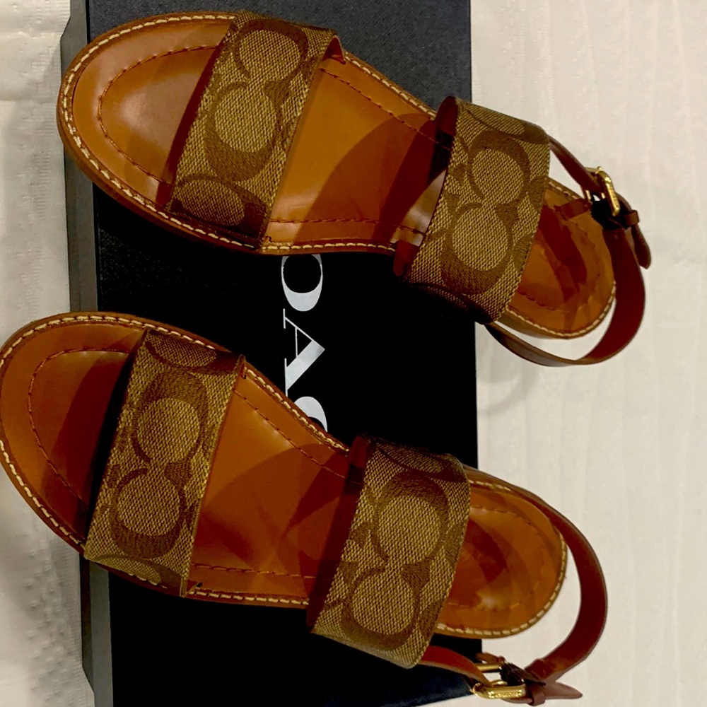 Brand new in the box sandals in khaki sandal color by coach. Women’s size 7 1/2